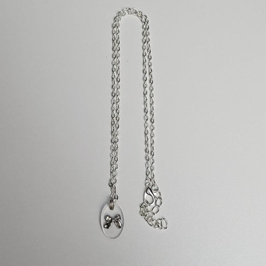 Bow resin necklace - test sample - Maker's One Takers