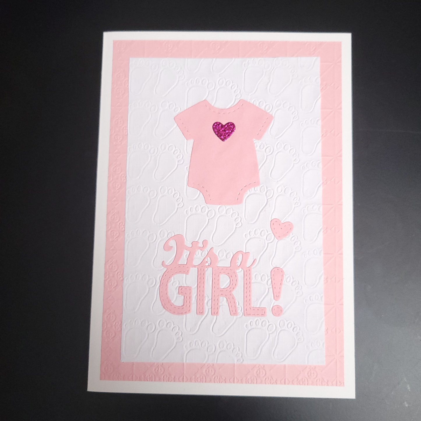 A6 Pink glitter heart onesie It's a Girl Baby blank card