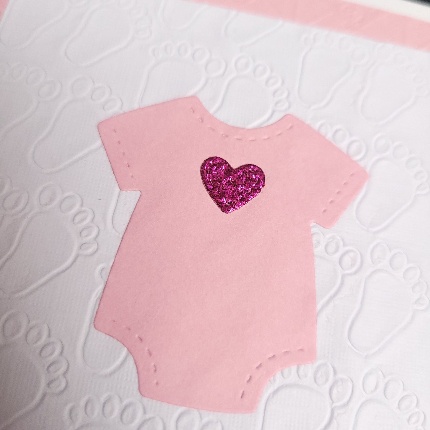 A6 Pink glitter heart onesie It's a Girl Baby blank card